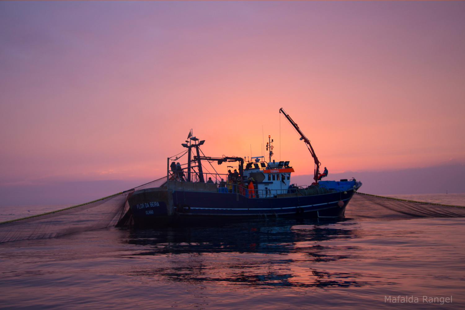 Industrial fishing boat at sunset