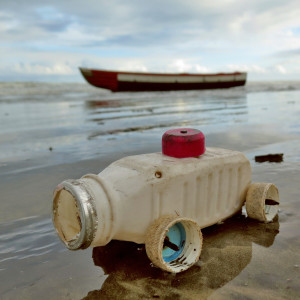 A miniature car made from rubbish on the beach